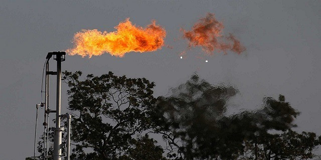 a_flare_burns_off_excess_gas_at_a_well_near_nordheim_-_credits_kin_man_hui_san_antonio_express-news