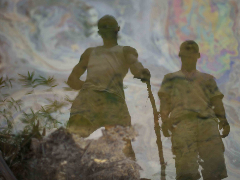 Reflection in oil polluted river, Nigeria