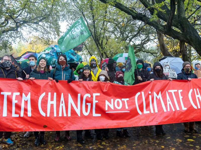 System change not climate change banner in Glasgow