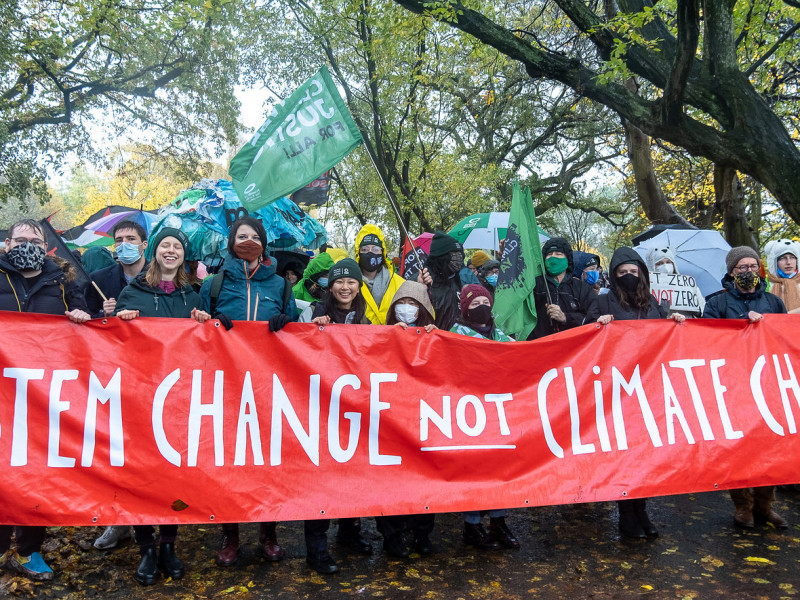 System change not climate change banner in Glasgow
