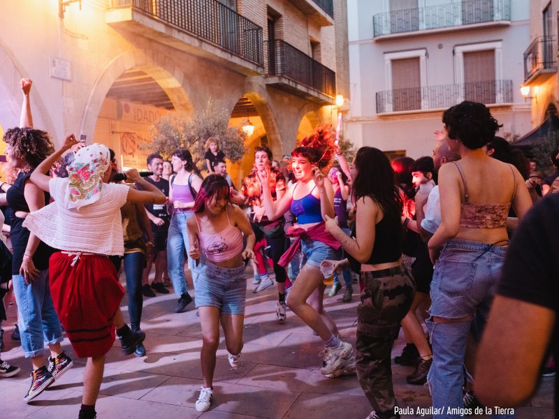 people dancing in the street at night