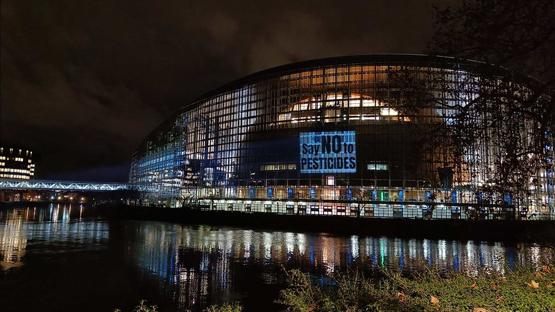 Projection on the facade of the European Parliament in Strasbourg which reads "Say NO to pesticides"