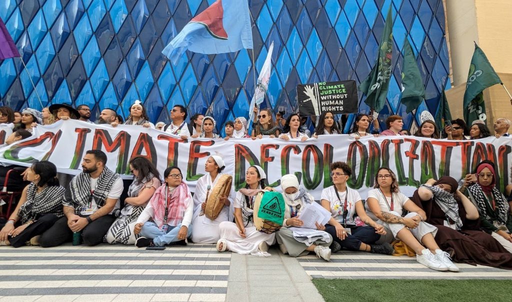 People protesting for climate decolonization at COP 28